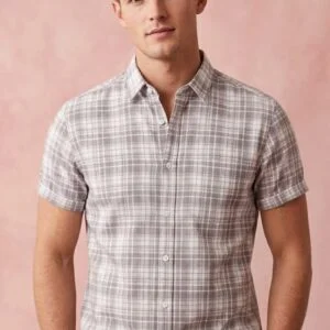 "Light grey and white plaid button-up shirt with collar, styled casually."